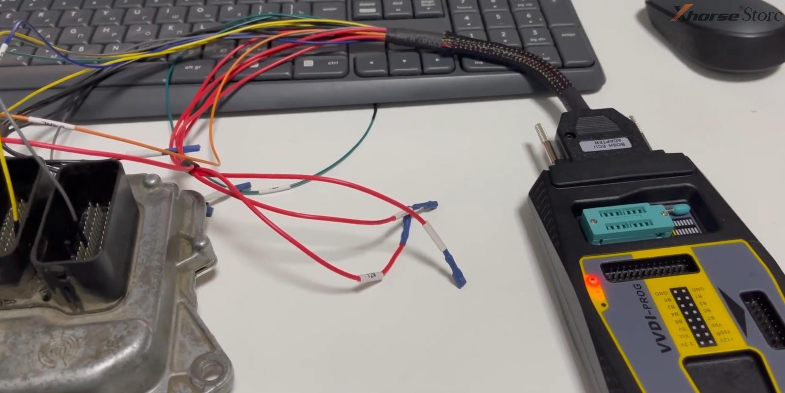 Xhorse VVDI2 programmer connected to ECU.